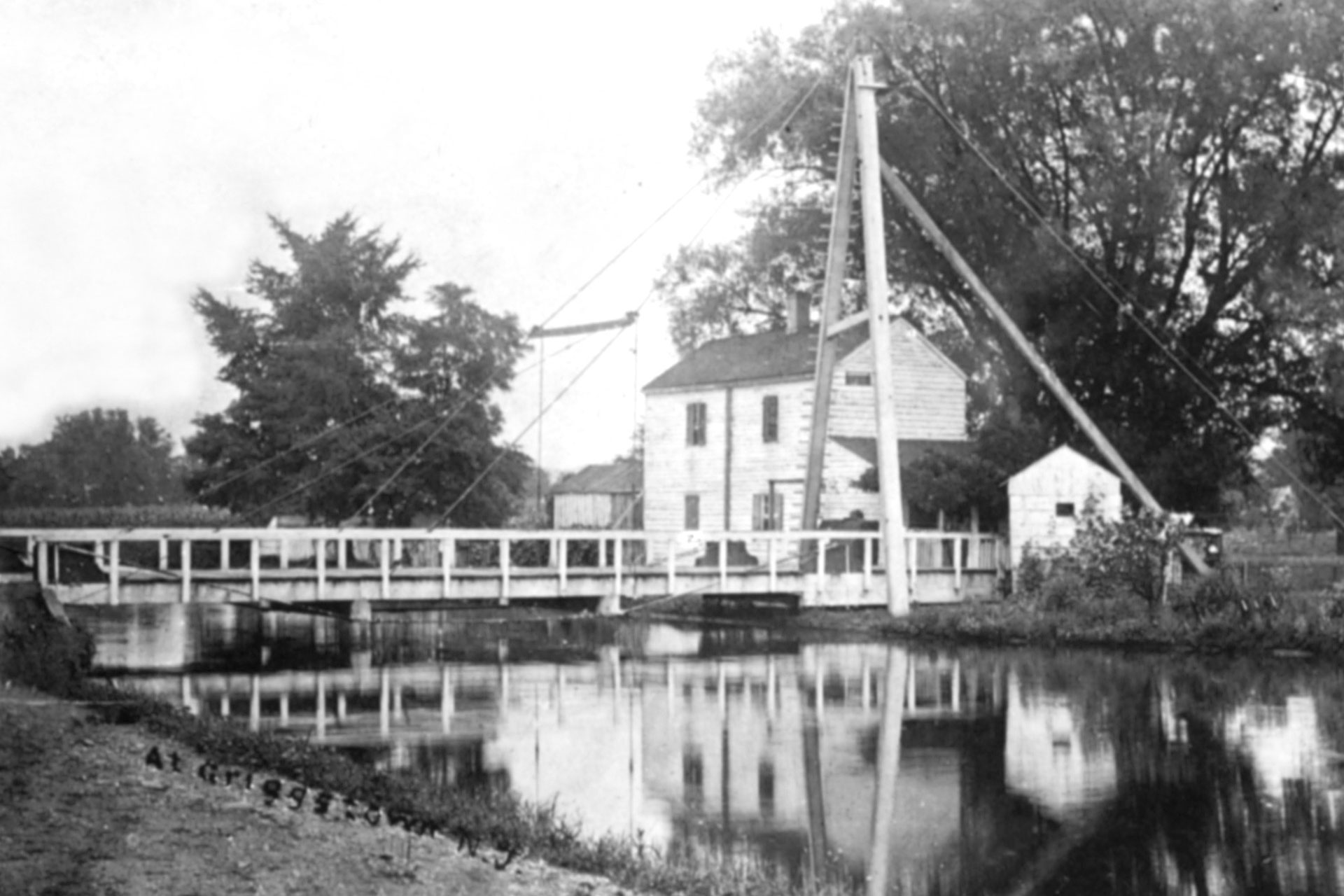 Although this photo is labeled Griggstown, it is actually an area to the south called Little Valley. The bridge pictured is a swing bridge, which would pivot out of the way to allow boat passage. The house served as the bridge tender’s residence, and the smaller structure his station.