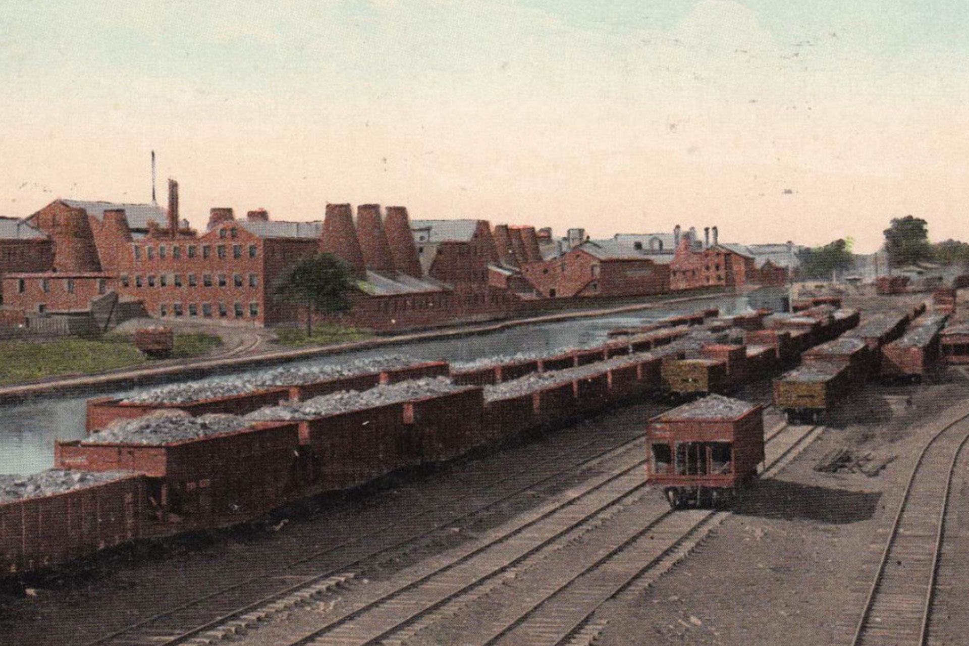 In this view of Trenton, the canal runs between the Pennsylvania RR yard knows as ‘Coalport’ and the Enterprise Pottery complex with its cone-shaped kilns.