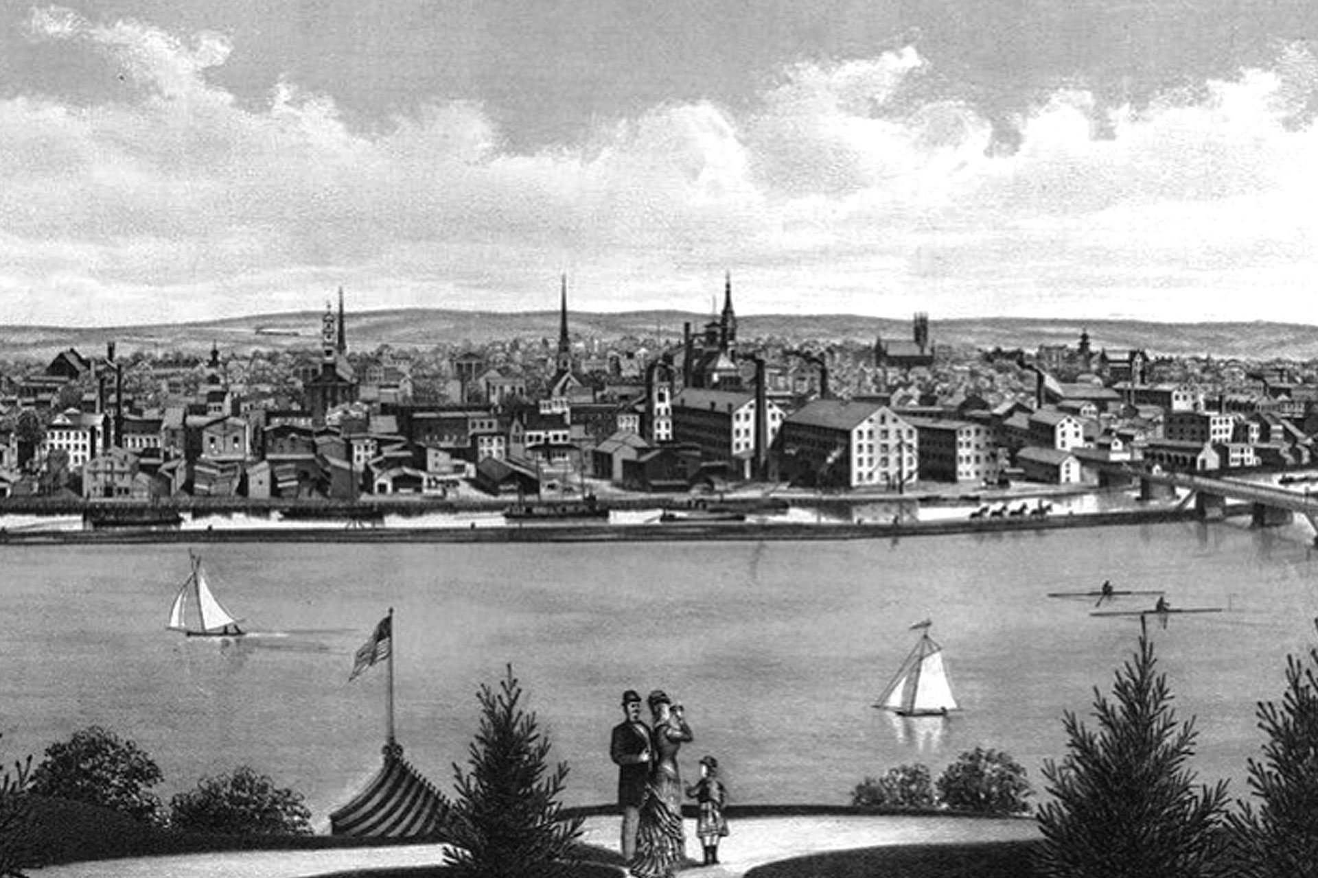 A beautiful 1880 illustration shows a bucolic view of New Brunswick. While a Victorian era family looks across the Raritan River and D&R Canal, we see a collection of canal boats, saling vessels, crew boats and work scows on the water, while horse-drawn carriages and trains pass over on bridges.