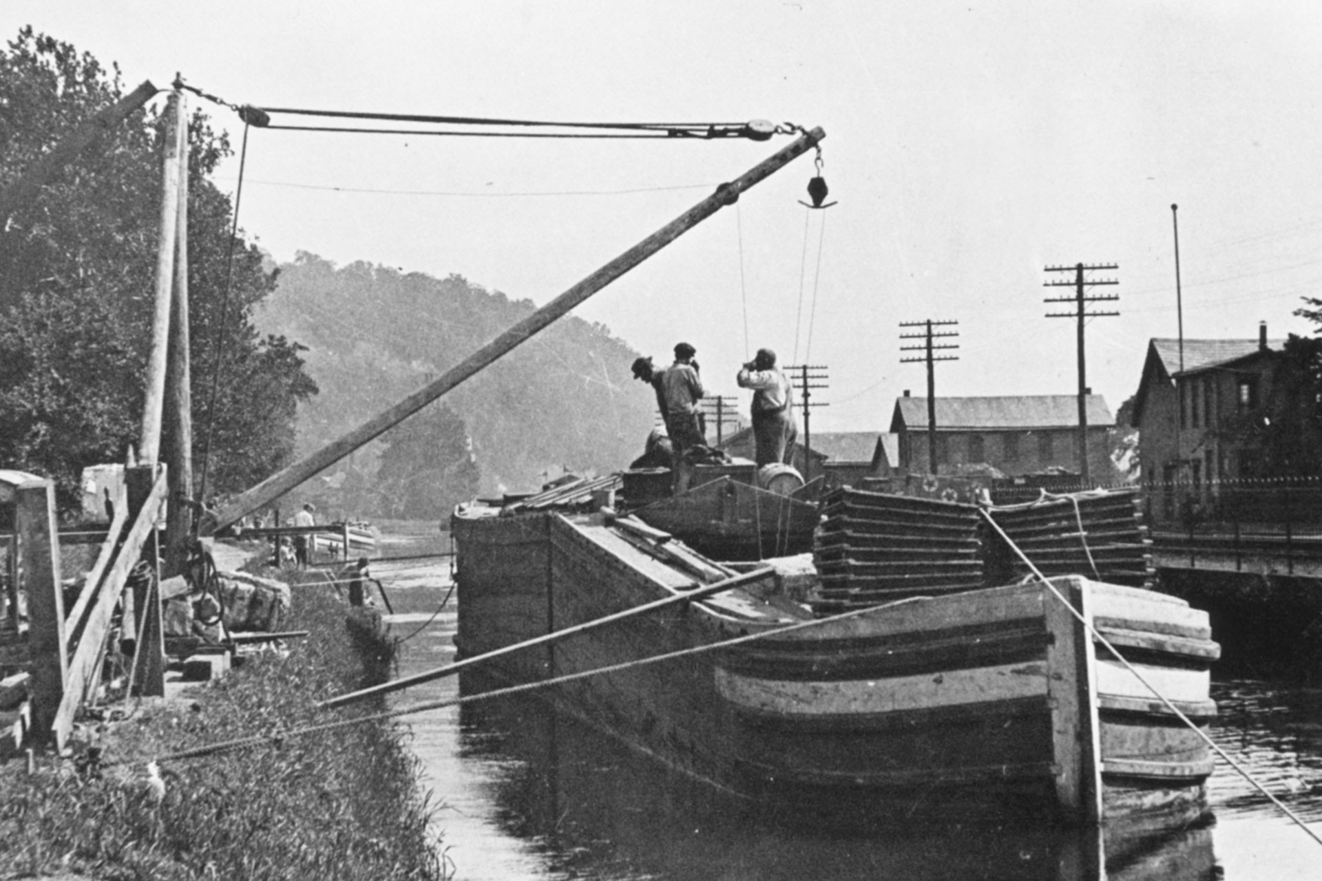 The Perseverance Paper Mill in Lambertville uses a motorized boom to load this Lehigh Coal and Navigation boat.
