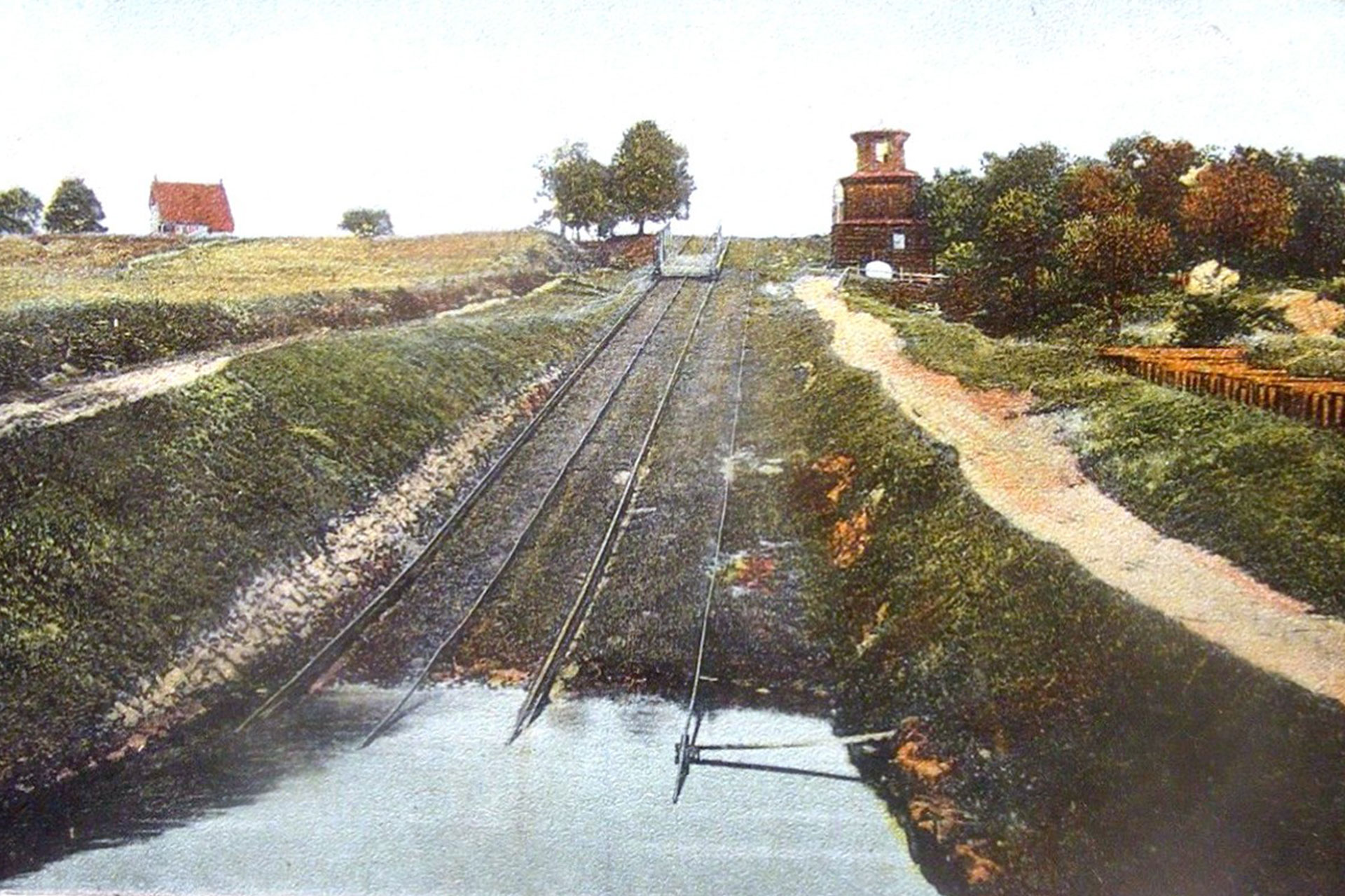 This colorized postcard view is of Plane 5 West in Port Murray. The empty cradle car on the plane indicates that this probably dates from after cargo traffic had dried up on the canal.
