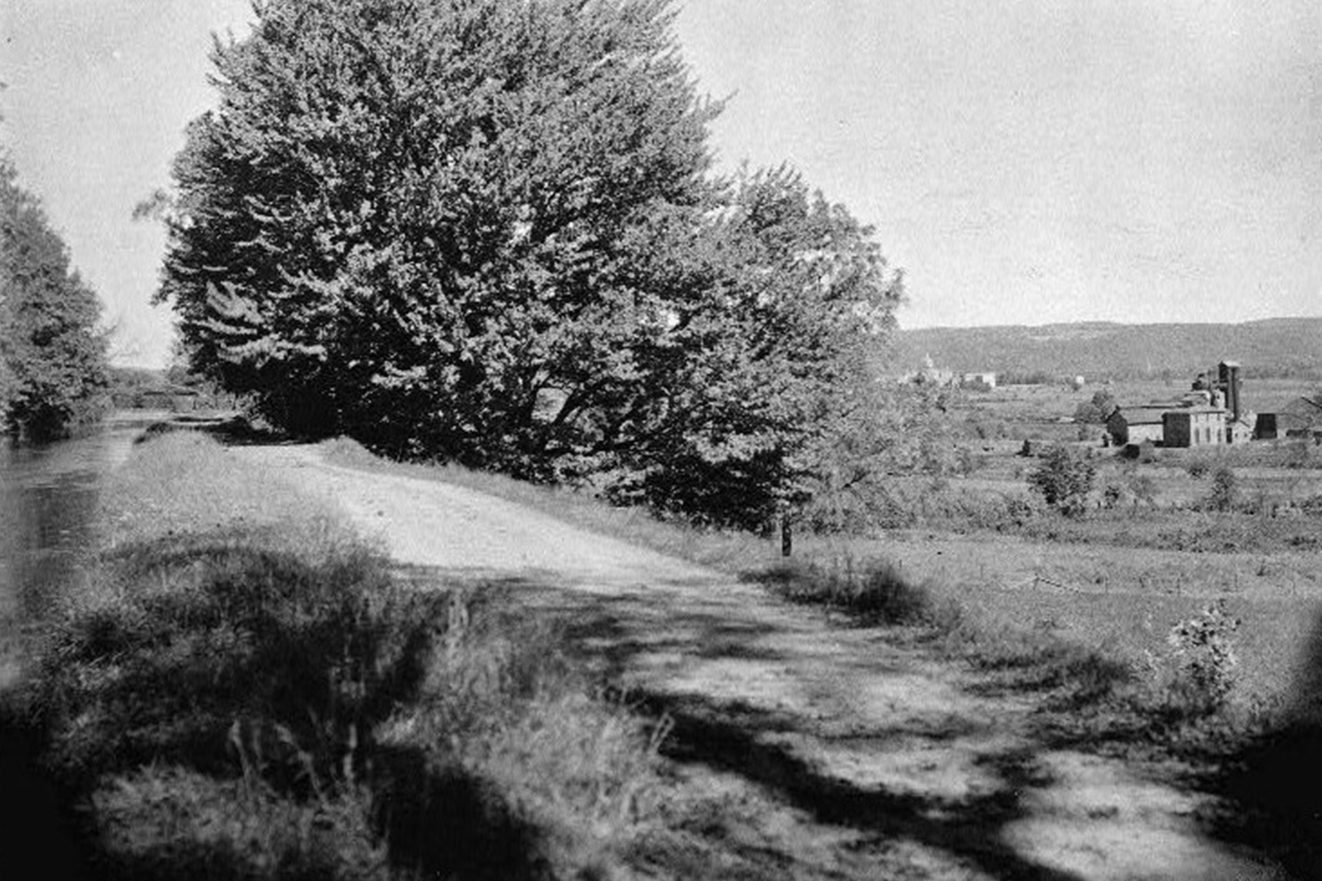 Looking east along the canal as it approaches Hackettstown. Warren Furnace can be seen on the right, and in the distance is the dome for Centenary College.