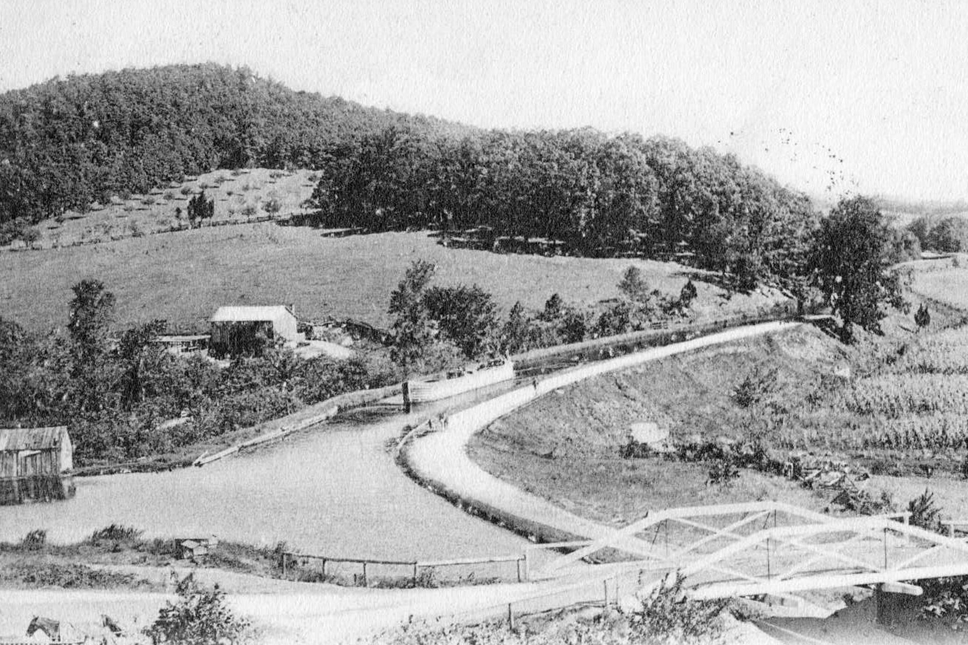Taken from Buck’s Hill, this view looks east on the canal over the Hope Street bridge (Route 46 today). A light canal boat can be seen heading west.