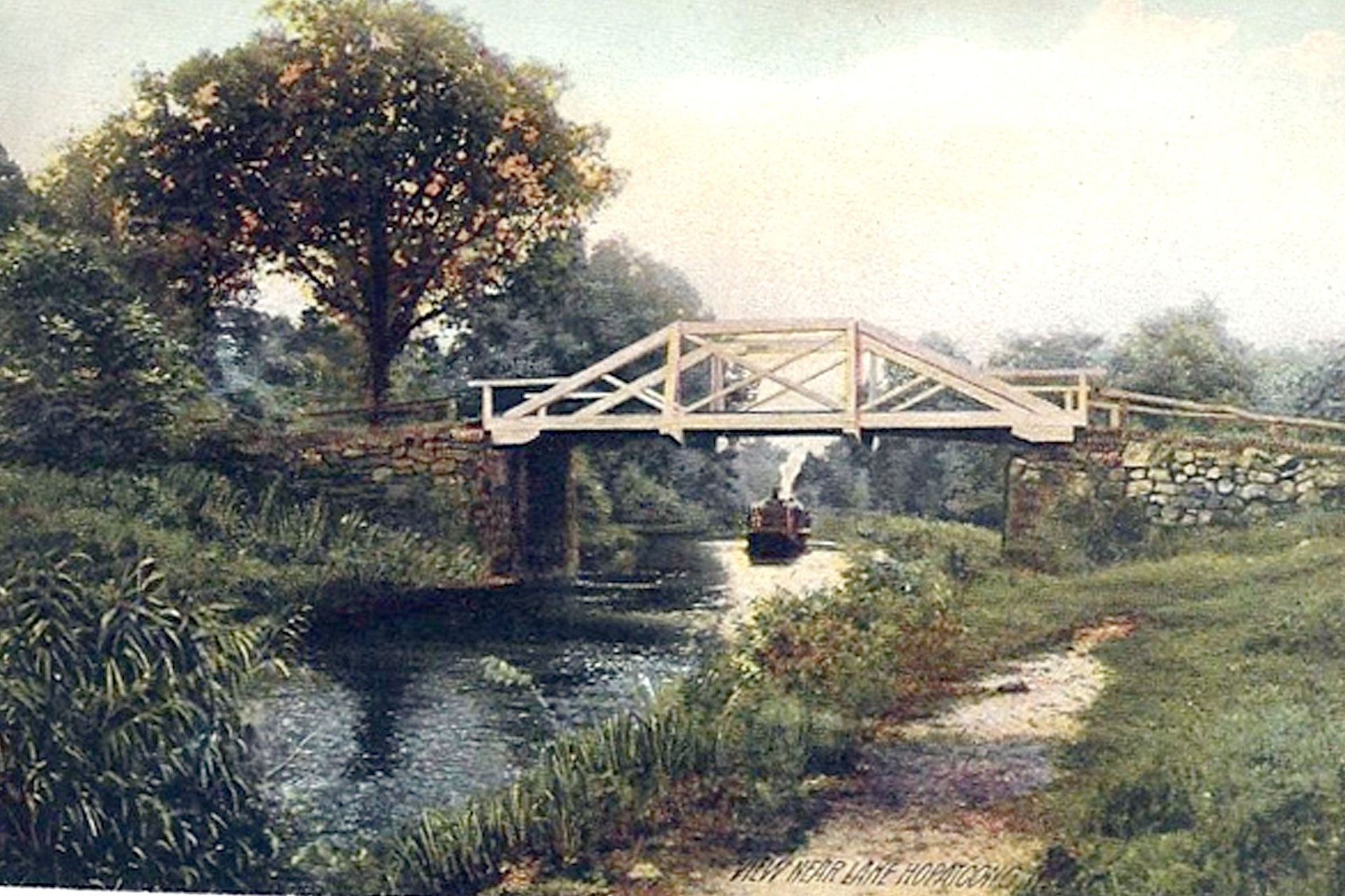 A Black Line steamer makes it's way up the feeder toward Brooklyn Lock. The bridge carried the road that is today’s Lakeside Boulevard, although it ran to the east of the current route.