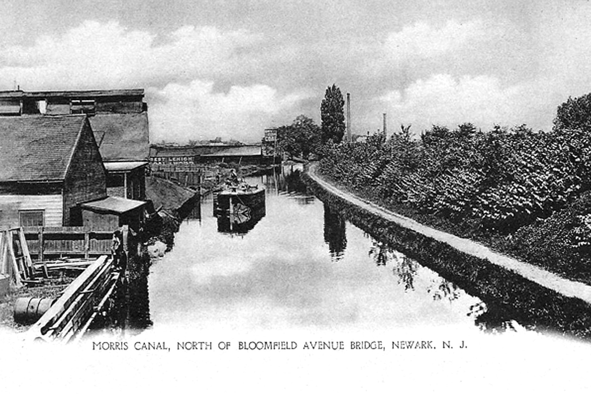 This view from the Bloomfield Ave bridge shows a light boat heading west on the canal, perhaps to pick up another load of cargo.