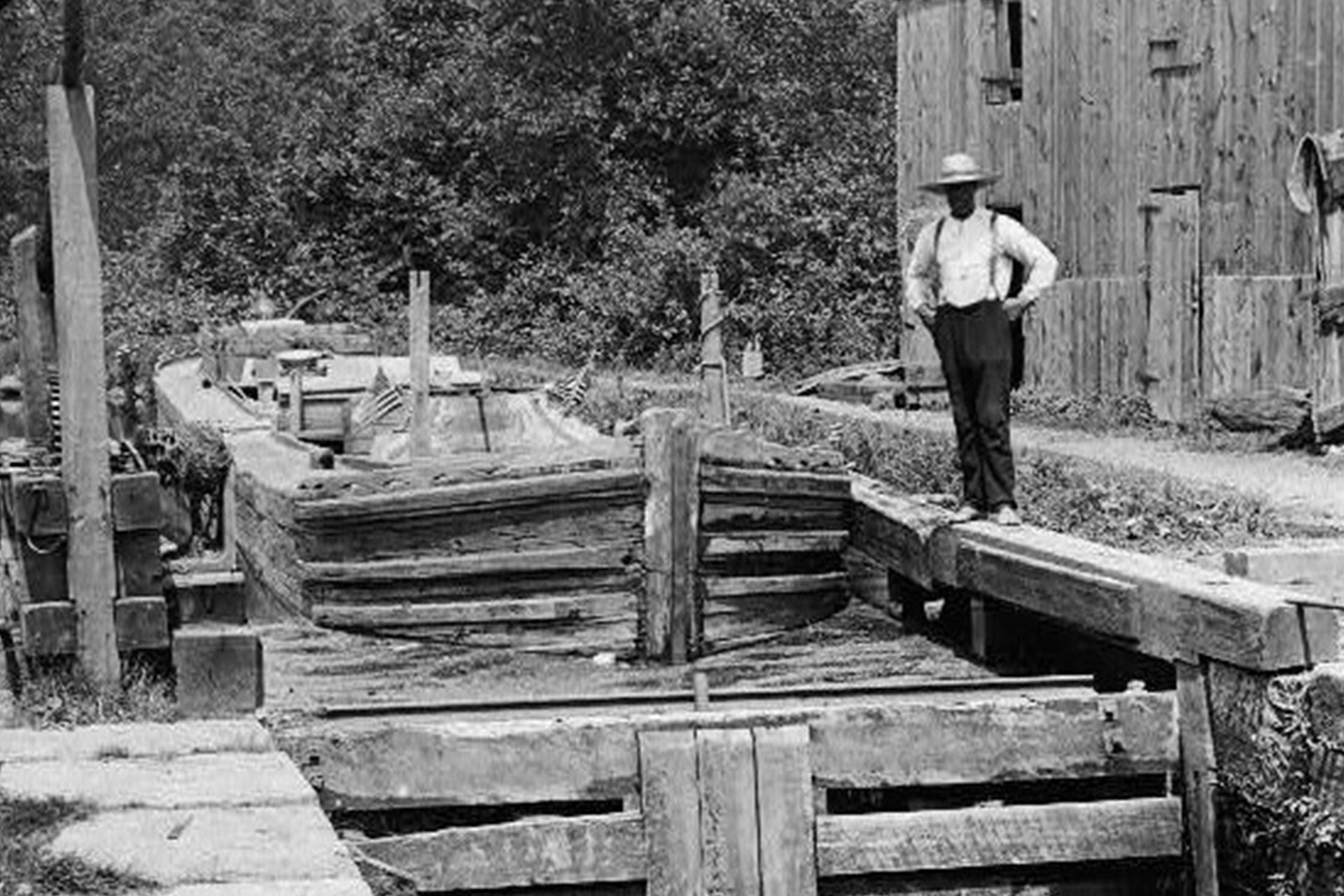 A boat waits to enter Lock 9 East in Powerville. Note the wood cutout to stage the boats.