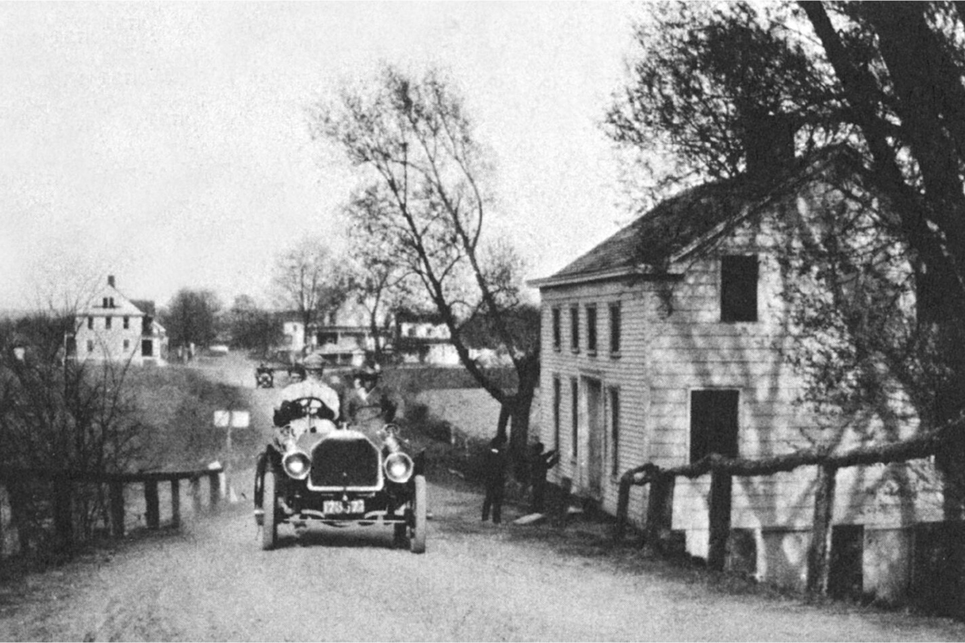 The Chapel Hill Road Bridge was one of two canal bridges in the village of Lincoln Park, the other being Main Street (Rte 202). The prescence of automobiles indicates that canal traffic has probably dried up.