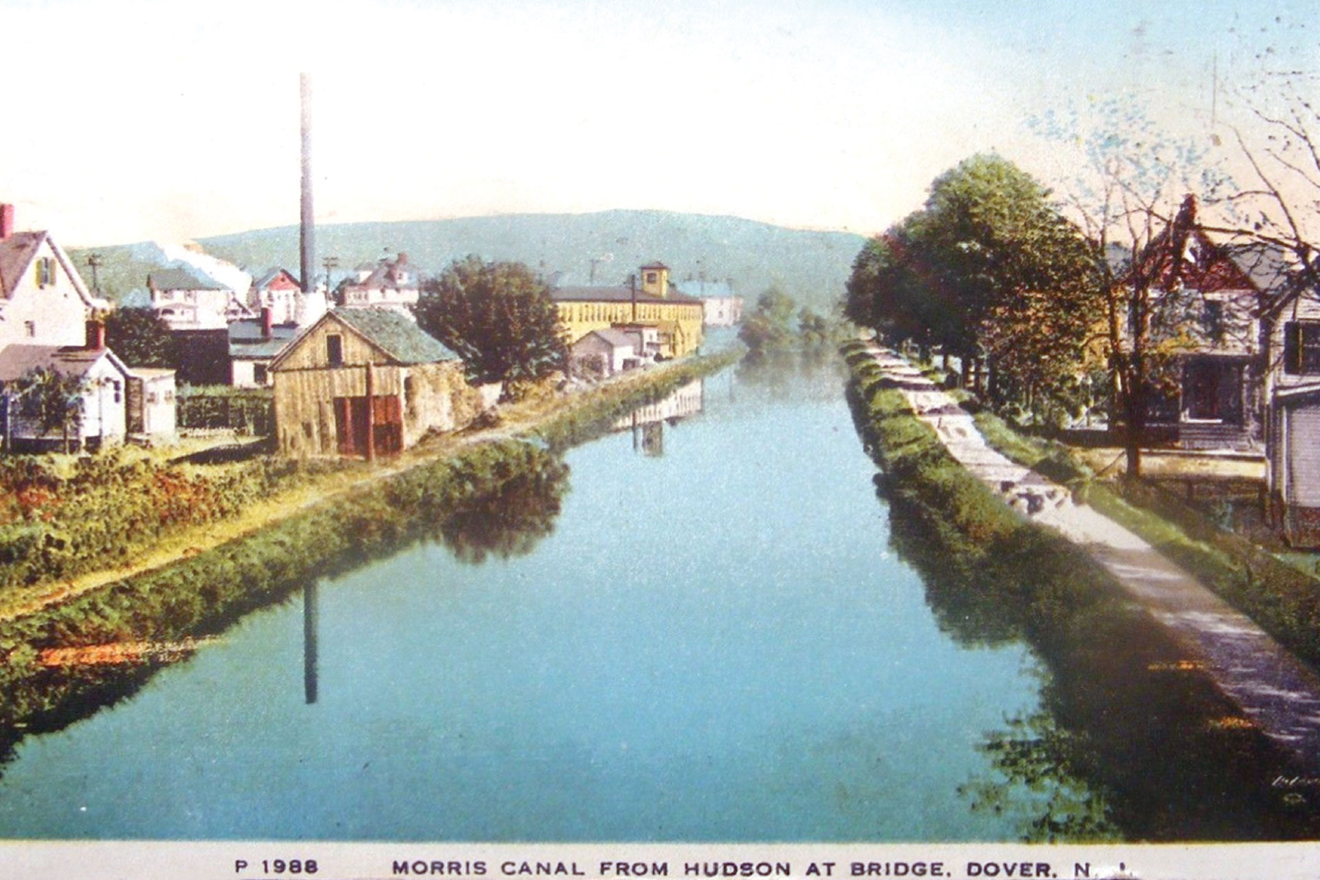 Eastward view from the Hudson Street bridge in Dover. The two houses on the right survive today.