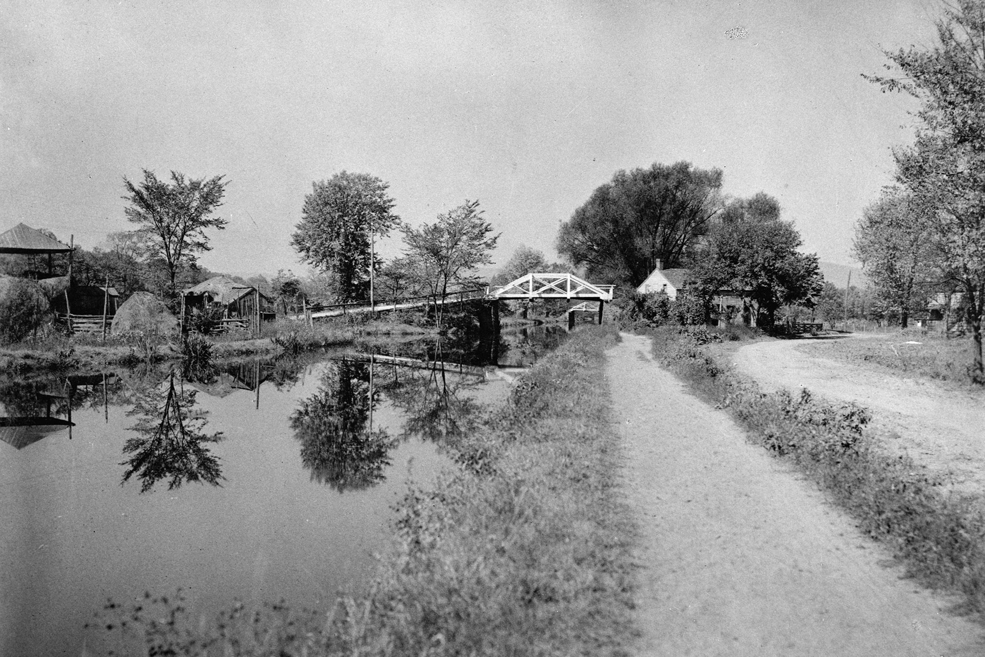 Looking along the towpath with an two unidentified Denville bridges in the background.