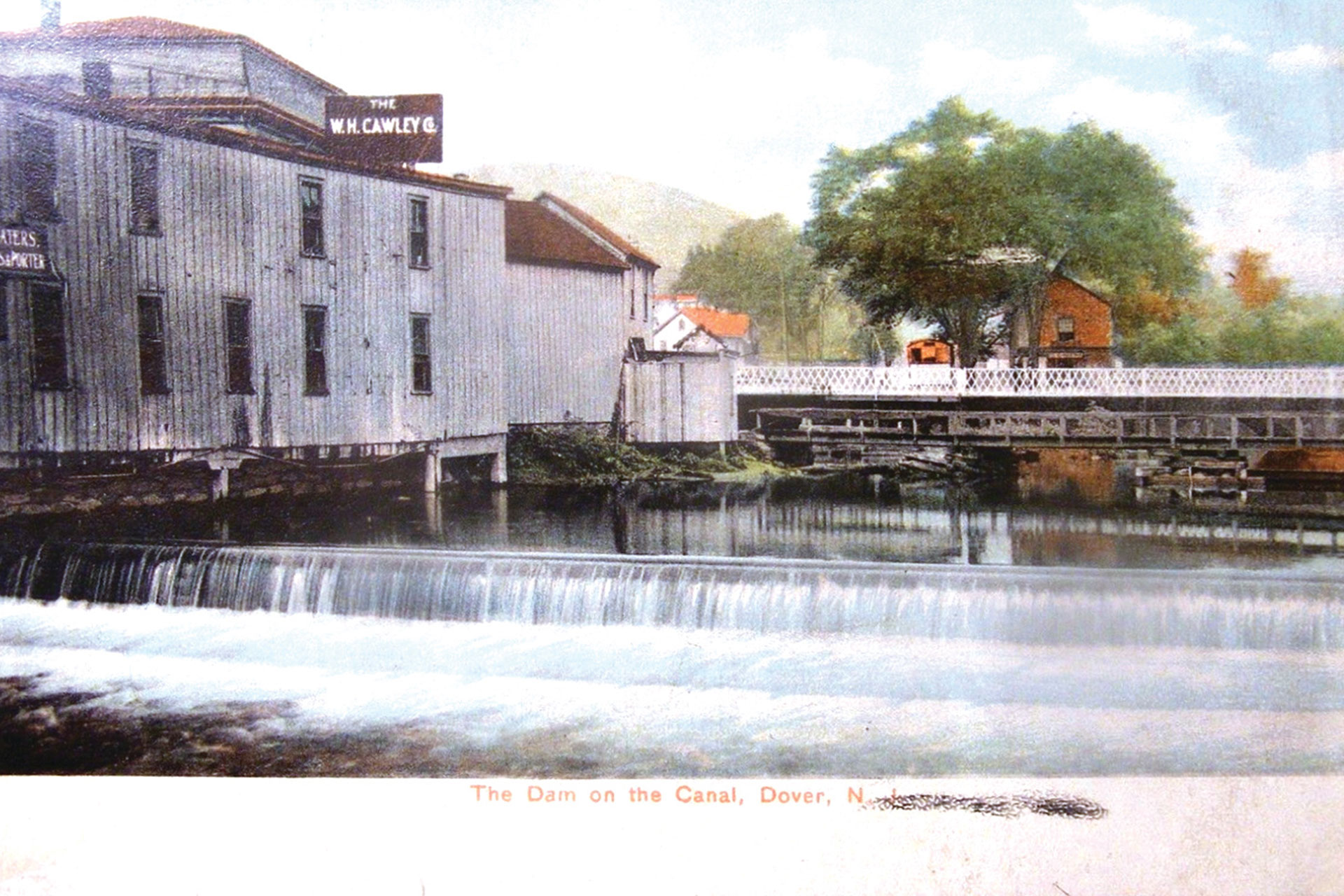 This dammed section of the Rockaway River in Dover allowed boats to navigate across. The mule bridge is visible in front of the Sussex Street bridge.