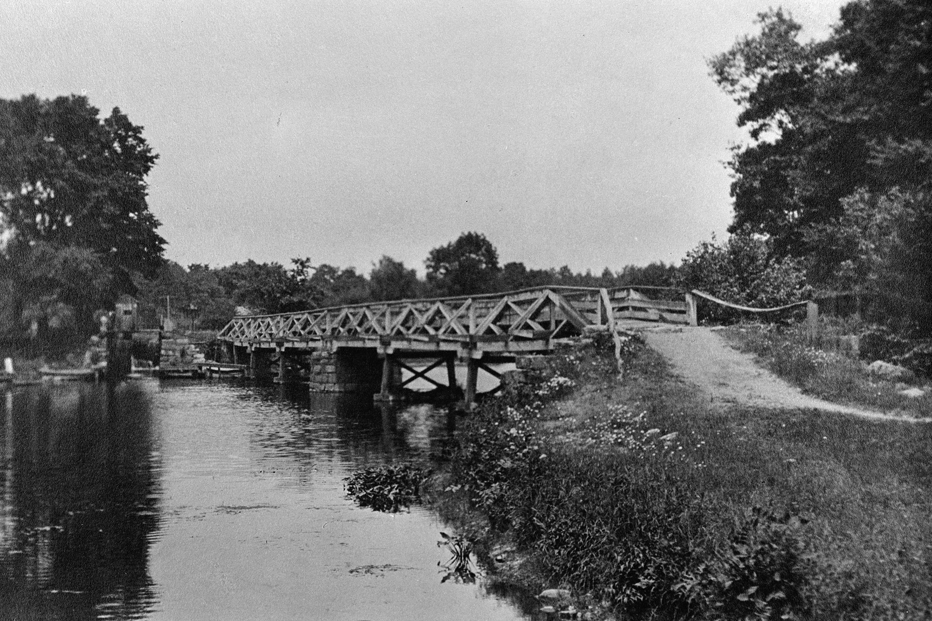 Powerville was a small village in Boonton Township where the canal crossed the Rockaway River. This view looks along the bridge that allowed mules and their tenders to cross the river. In the distance is Lock 10 East.